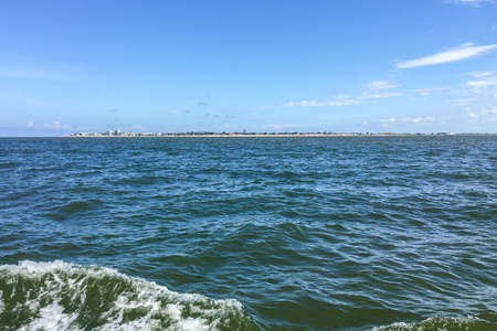 East Frisian Island of Norderney on the North Sea seen from a boat with the sandy beach and hotelsの写真素材