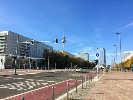 Karl-Marx-Allee on a Sunday with almost no traffic. Alexanderplatz with the famous Fernsehturm in the background on a sunny autumn day.のeditorial素材