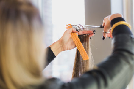 stylist cutting long hairの写真素材