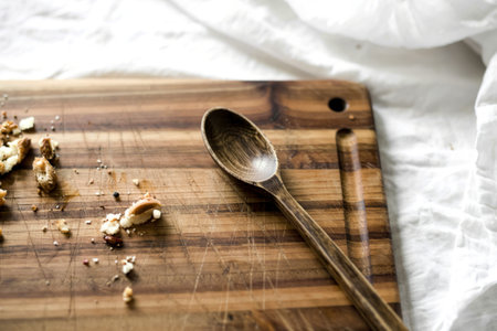 A photograph of a well-worn acacia wood cutting boardの写真素材