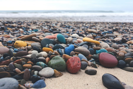 A photo of a variety of sea pebbles in different colorsの写真素材