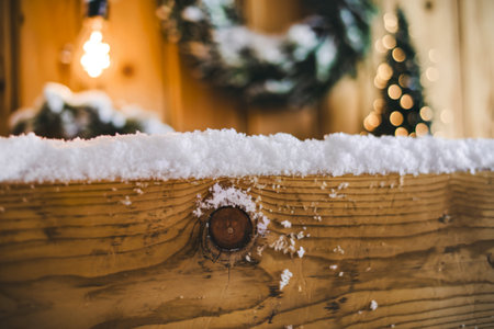A photo of snow accumulation on a wooden surfaceの写真素材