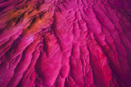 A photo of a bright pink textured backgroundの写真素材