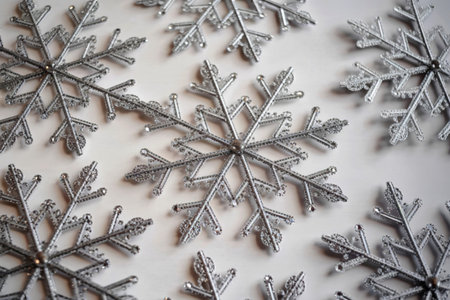 intricate snowflake decorations against a white background