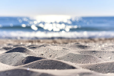 a pristine beach with soft, undulating  sand in the foregroundの写真素材