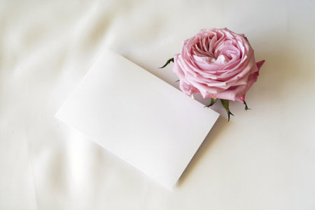 A birthday greeting card featuring a close-up of delicate pink rosesの写真素材