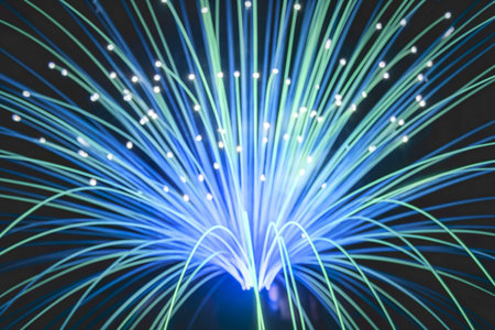 A photo of a vibrant display of light emanating from numerous fiber optic strands.の写真素材