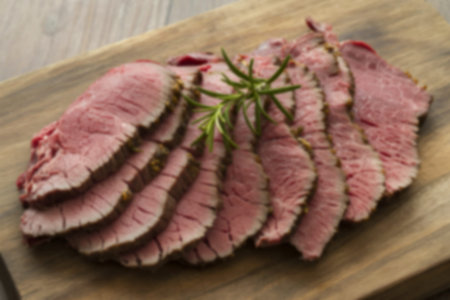 A photograph of thinly sliced roasted beef