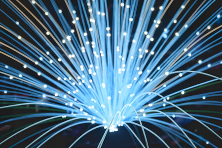 A photo of a vibrant display of light emanating from numerous fiber optic strands.
