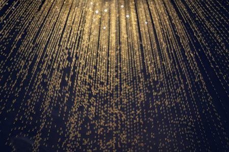 a mesmerizing display of golden particlesの写真素材