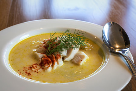 a creamy yellow-colored soupの写真素材