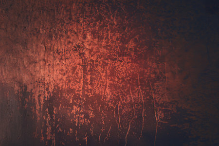 A photo of a textured, rustic surface with a deep reddish-brown hueの写真素材