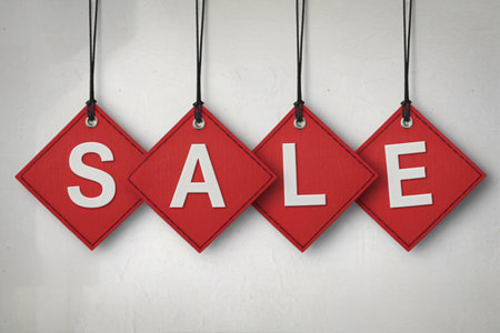 four vibrant red, diamond-shaped tagsの写真素材