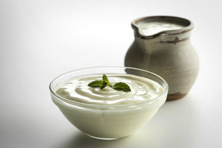 glass bowl filled with thick, creamy homemade yogurtの写真素材