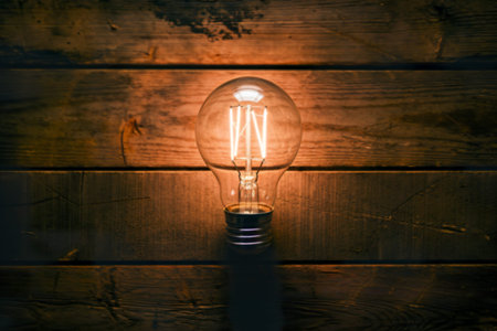 a light bulb on a wooden backgroundの写真素材