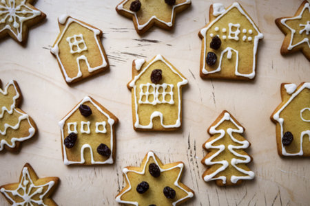 A photo of gingerbread cookies with white icing decorations.