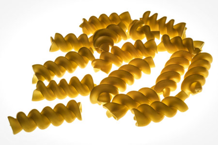 golden yellow fusilli pastaの写真素材