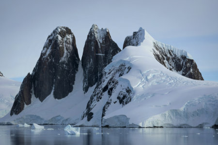 towering mountain peaks with steep, jagged black rockの写真素材