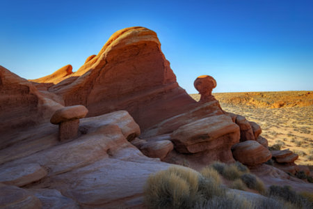 a dramatic desert terrain under a brilliant azure skyの写真素材
