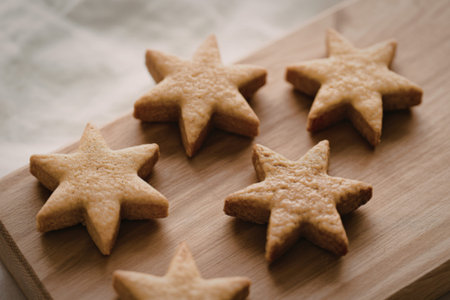 A close-up photograph of brown star-shaped gingerbread cookies