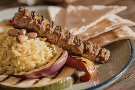 A close-up photograph of an elegantly plated Middle Eastern meal