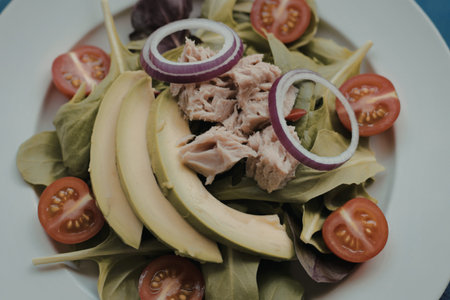 A vibrant photograph of a fresh mixed greens saladの写真素材