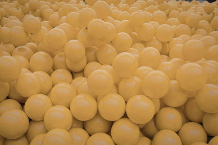 A photograph of hundreds of bright yellow balloonsの写真素材