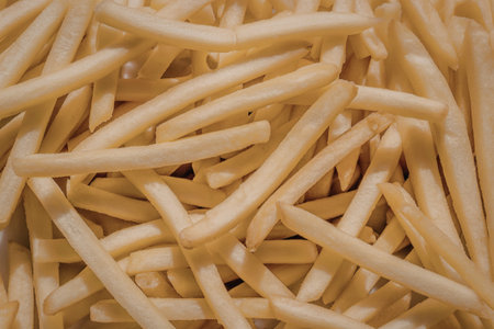 A close-up photograph of golden-brown french friesの写真素材