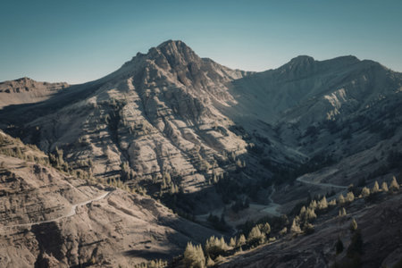 A photo of a mountain landscape with a clear blue skyの写真素材