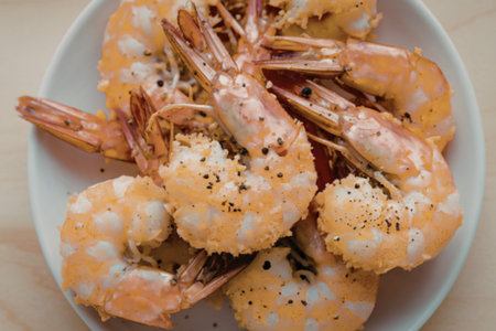 a plate of golden-brown, crispy shrimps