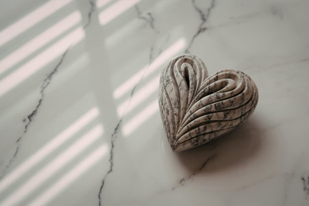 A detailed photograph of an intricately carved stone heart