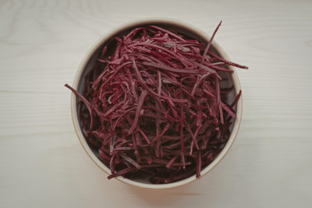 a bowl filled with shredded beetroot