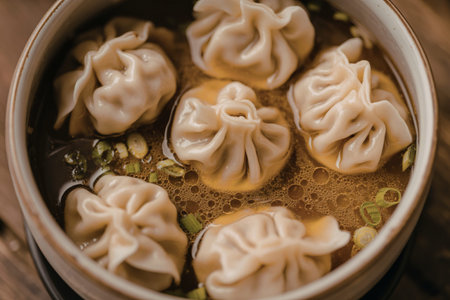 A photograph of a bowl filled with dumpling soup