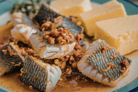 A close-up photo of a plate with chunks of fish
