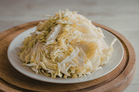 a white plate with chopped cabbage
