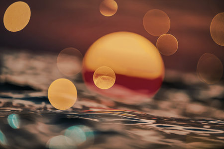 sunset over the ocean with an intense bokeh blur effect