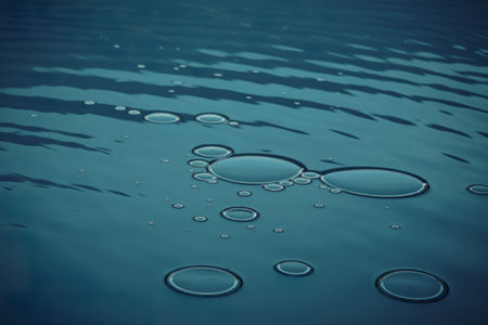 A photo of an abstract blue background with oil bubbles