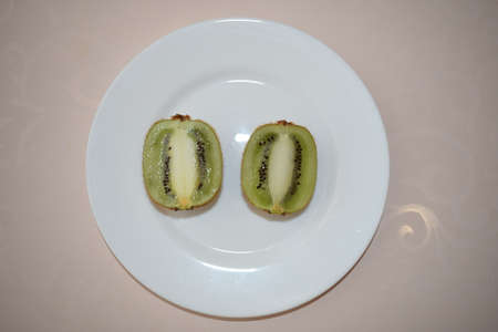 Kiwi on a white plate. Still life. Fruit on a plate.の写真素材