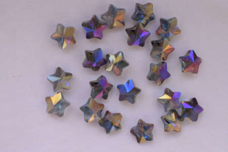 Beads in the shape of a star on a white background. Goods for creativity and needlework.の写真素材