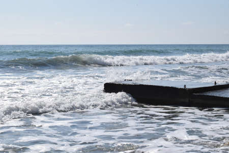 Pier on the Black Sea. Wind, high waves. The photo was taken in the spring in the resort town of Anapa.の写真素材