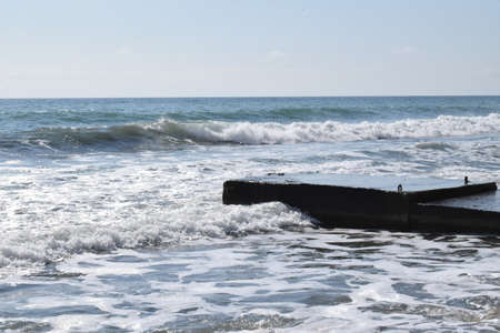 Pier on the Black Sea. Wind, high waves. The photo was taken in the spring in the resort town of Anapa.の写真素材