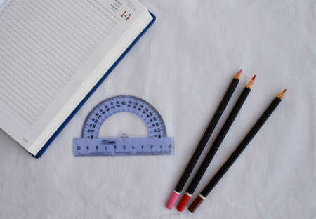 Stationery. Notepad, ruler and pencils on a white background. The view from the top.の写真素材