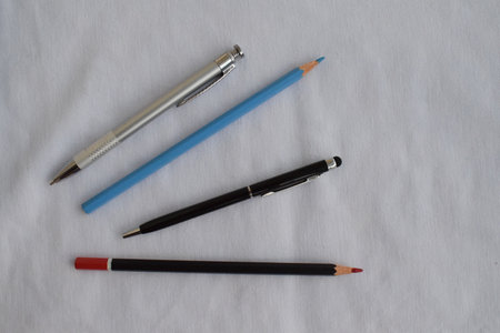 Stationery. Pencils and pens on a white background. The view from the top.の写真素材