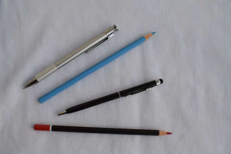 Stationery. Pencils and pens on a white background. The view from the top.の写真素材