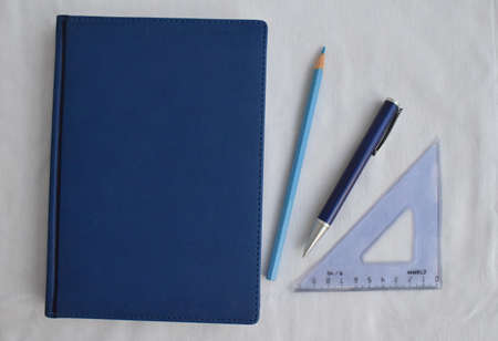 Stationery. Notepad, pencil, pen, ruler on a white background. The view from the top.の写真素材