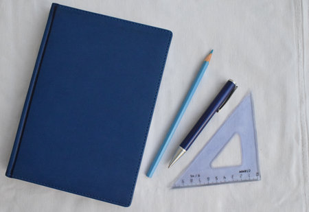 Stationery. Notepad, pencil, pen, ruler on a white background. The view from the top.の写真素材