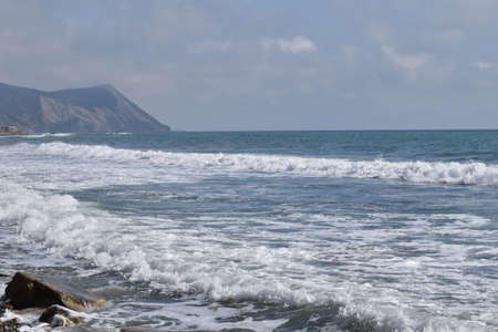 View of the Black Sea, beach and mountains. The resort town of Anapa. Russia. Photo taken in spring.の写真素材
