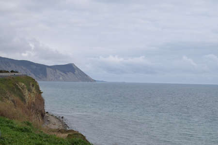 View of the Black Sea, beach and mountains. The resort town of Anapa. Russia. Photo taken in spring.の写真素材