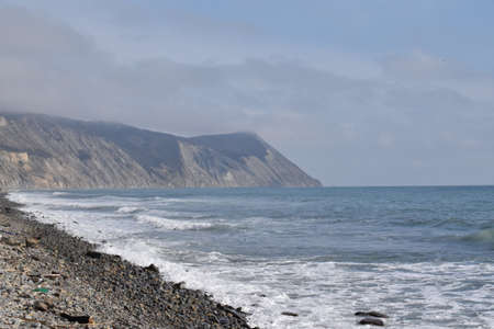 View of the Black Sea, beach and mountains. The resort town of Anapa. Russia. Photo taken in spring.の写真素材
