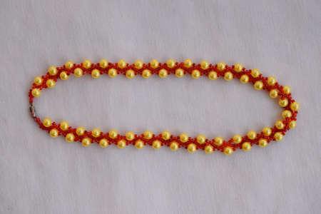 Beautiful beaded necklace. Handmade decoration. Blue and white colors.の写真素材